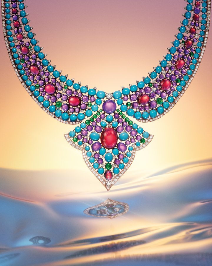 Bvlgari's Lotus Cabochon necklace is set with round diamonds, turquoises, rubellites, amethysts and cabochon emeralds. Crafted using Bvlgari's ‘tappetino' technique, each stone is held by claw-like architectural elements.