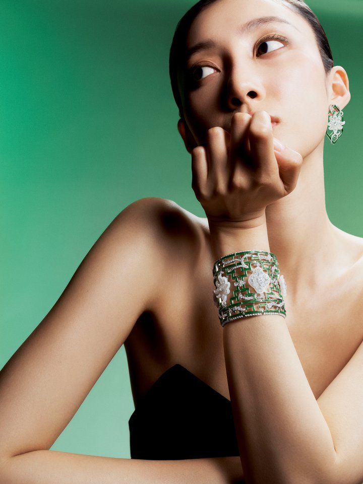 The Bamboo Blossom cuff interprets the intricate marquetry of the Qianlong Palace, in Beijing's Forbidden City, in shiny green and matte white jade and diamonds. ©Boghossian