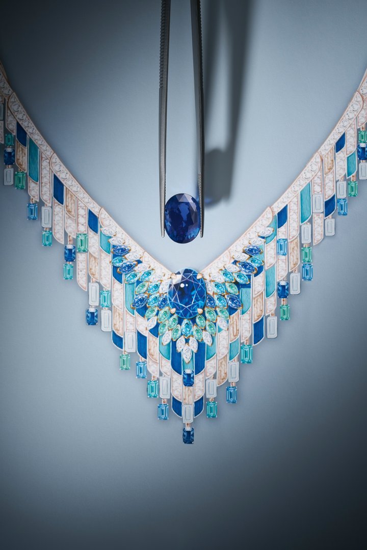 At the centre of the Gold Reflections Necklace, an oval blue sapphire from Madagascar, weighing 13.05 carats, and a double row of marquise-cut sapphires, tourmalines and aquamarines are framed by a cascade of opals, turquoise, diamonds and gold with Decor Palace engraving. ©Piaget