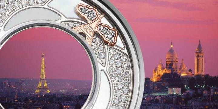 Europe - The World Charm of Paris is carefully assembled with shining nacre and shimmering diamonds amidst the illustration of the Eiffel Tower, evoking the beauty of a visit to the French capital and its magnificent landmark during a bright sunny day in summer.