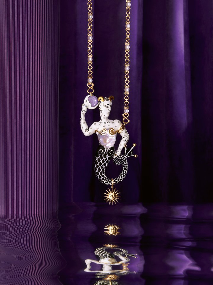 Fantasmagoria Collection. The Neptune Necklace is made from 18K yellow gold and silver. Its fire-enamelled pendant is set with diamonds and sapphires. A baroque freshwater pearl highlights Neptune's torso as he holds a purple chalcedony cabochon in his hand. ©Calypso Mahieu