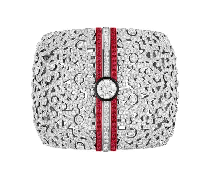 Chanel Print cuff in white gold, diamonds, rubies, carbon, black lacquer and red aluminium with a 3.08-carat brilliant-cut diamond. The cuff can be worn in several ways thanks to interchangeable shells: a white gold and diamonds version, a carbon version or a combination of the two., Haute Joaillerie Sport collection. ©Chanel