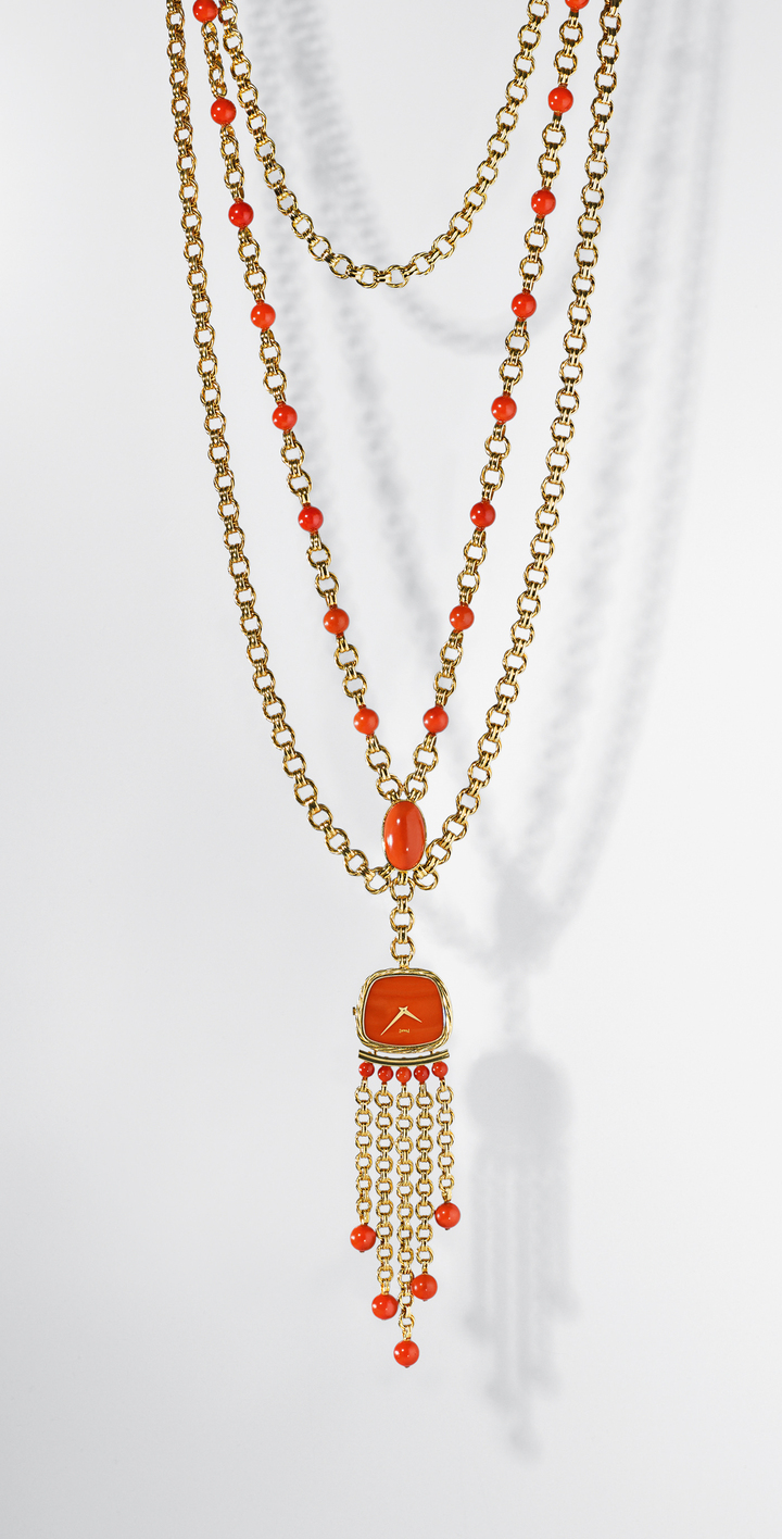 Piaget Swinging Sautoir watch, yellow gold, coral beads and dial. Manufacture 9P ultra-thin hand-wound movement. 1970. Piaget Private Collection.