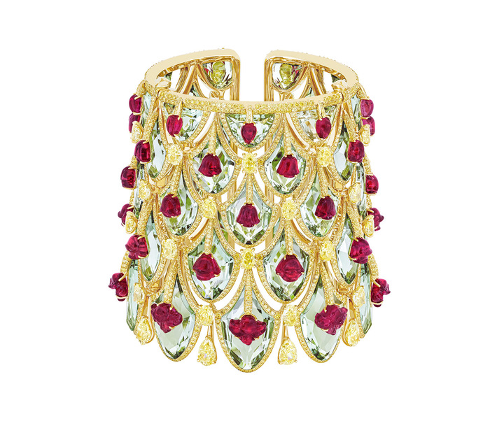The Winter Roses cuff draws its inspiration from the Rose Gate of Jaipur's City Palace; a tribute to the Goddess Devi and the winter season. Carved rubellite flowers are set atop sea-green prasiolites, using the Kissing technique, while pendants of yellow diamonds are held beneath. ©Boghossian