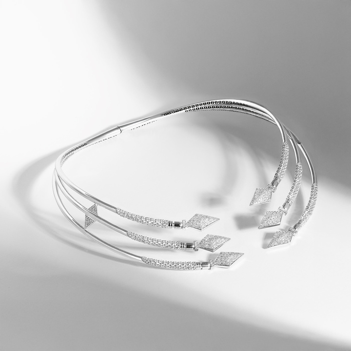 The Masai Triple Choker features three diamond-set spears on an open-front necklace