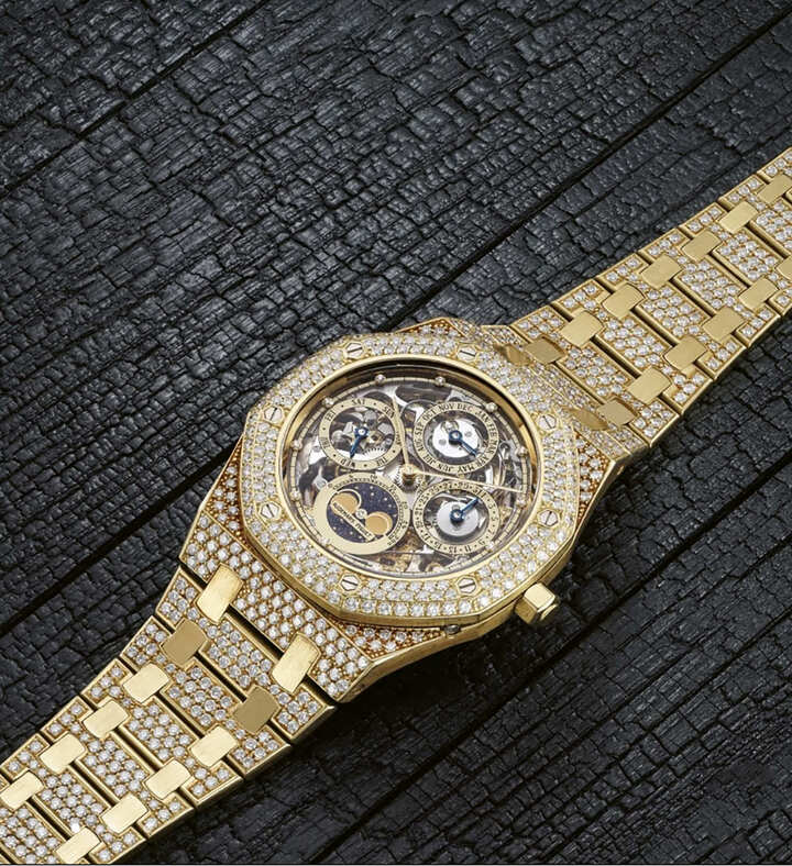 Haute Joaillerie Royal Oak Perpetual Calendar Openworked 25659BA, N° 03, dial side. Perpetual Calendar: day, date, month, phase and age of the Moon. Extra-thin (3.95mm) and openworked self-winding Calibre 2120/2800, movement 274089. Bracelet 344. 39mm case C31040 in 18k yellow gold entirely set with brilliant-cut diamonds. Sold on December 15, 1988. Sold at auction by Phillips in Geneva on May 6, 2022, lot 72.
