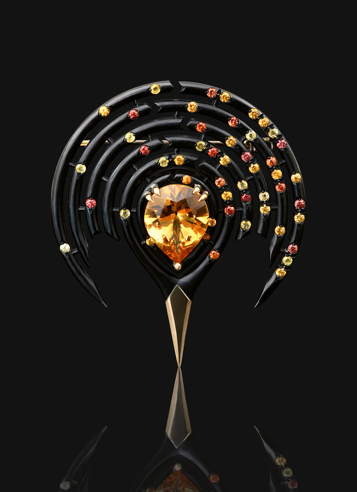 The Foraminifera brooch in black chrome-plated silver and 18k yellow gold, set with a custom-cut citrine from old stock. The sapphires encircling the citrine symbolise the destruction of plankton due to ocean acidification.